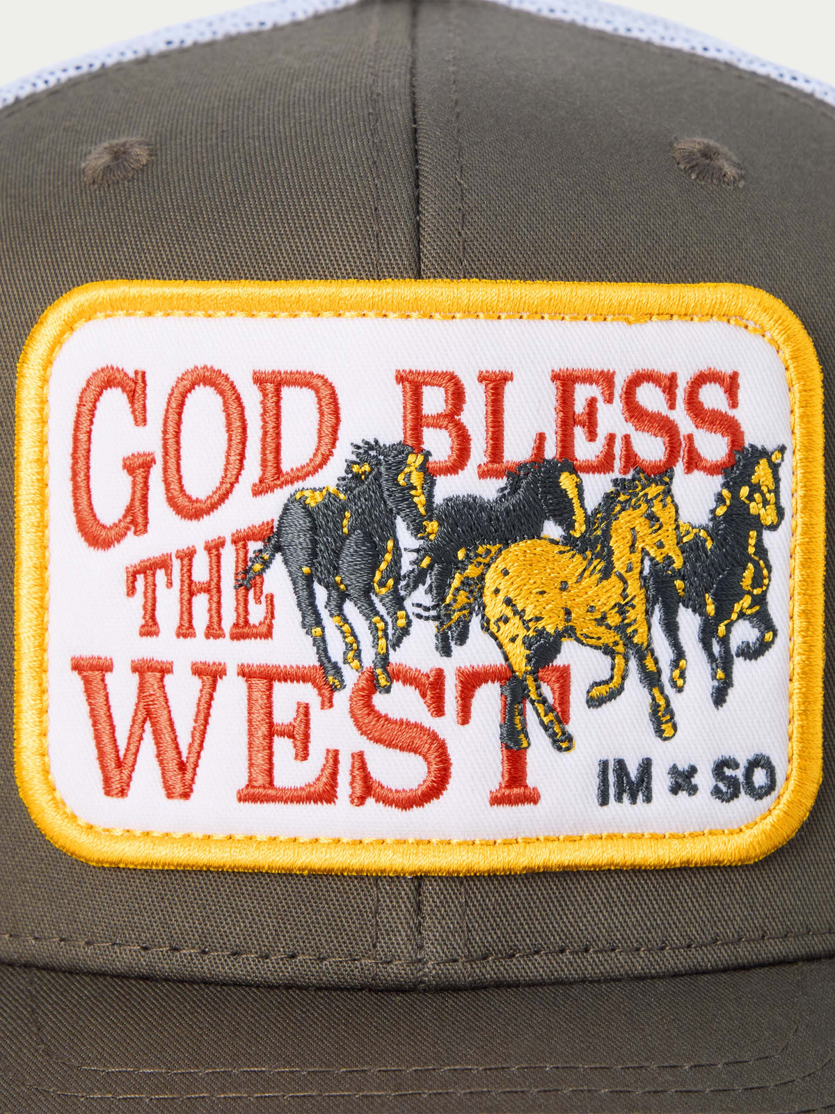 'God Bless the West' embroidered front patch on brown trucker cap