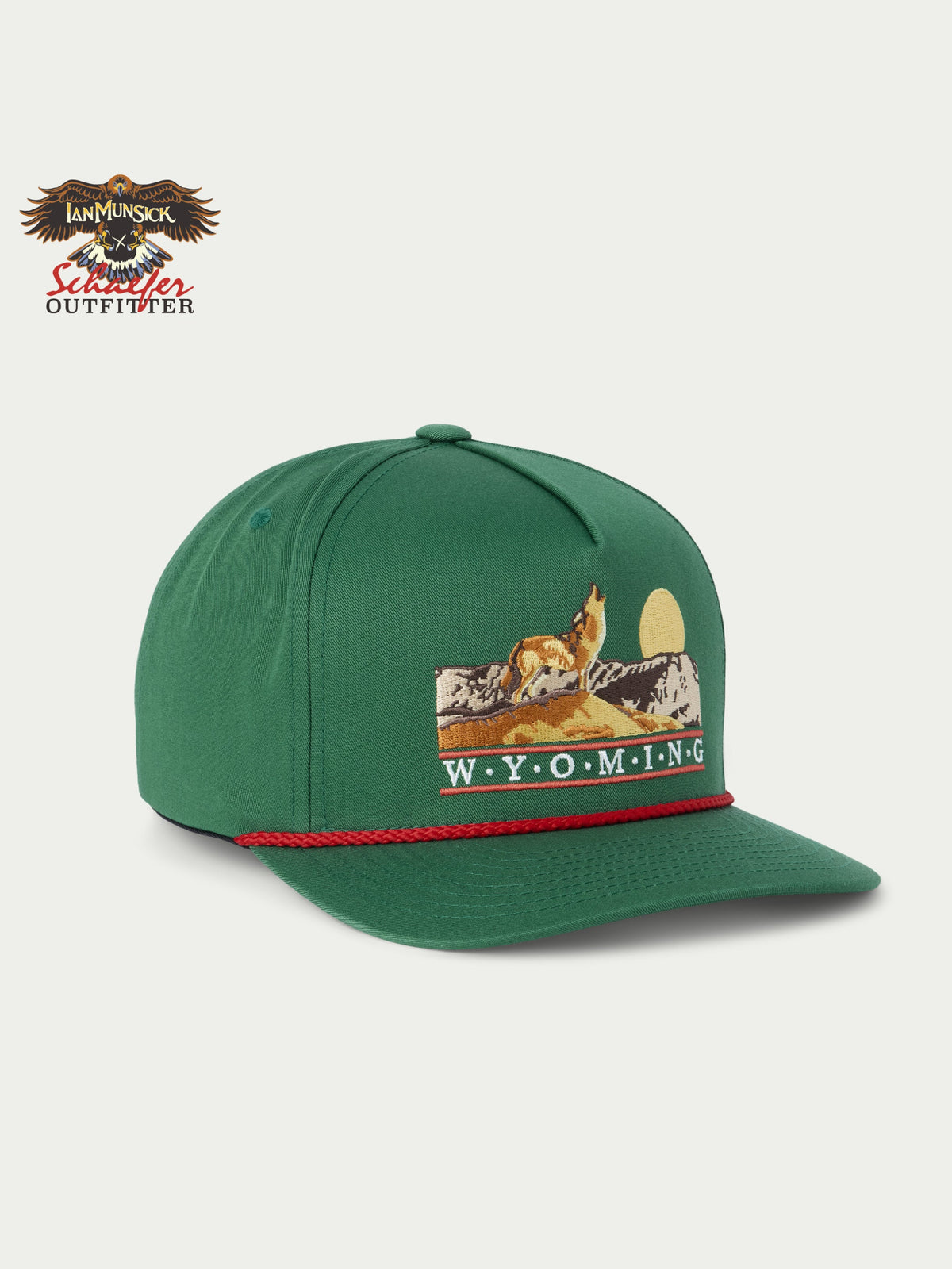 Green snapback cap with Wyoming-themed front graphic and red trim