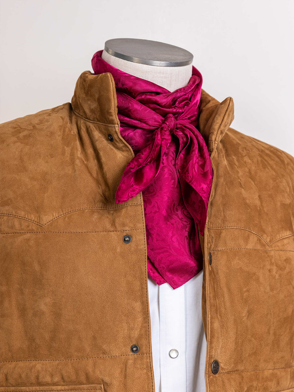 Burgundy jacquard wild rag scarf tied in a bow at the neck