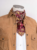 Paisley wild rag scarf in rust, red, and gold paisley print, worn at the neck