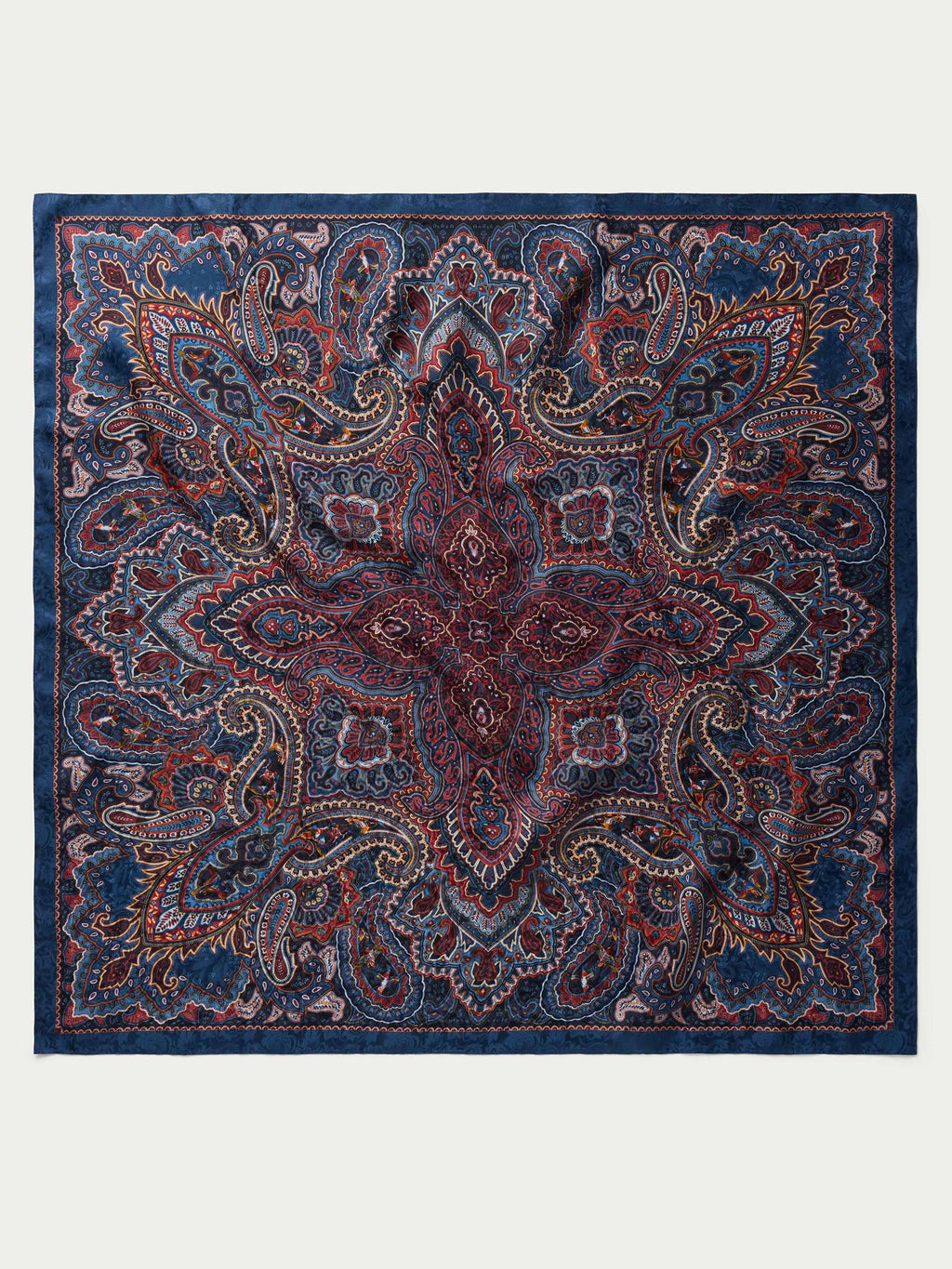 Paisley wild rag scarf in navy with rust paisley and border, square folded