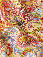 Paisley wild rag fabric close-up with detailed red, yellow, blue, and green motifs