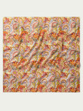 Paisley wild rag scarf with colorful red, orange, blue, and yellow swirl pattern