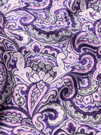 Purple paisley wild rag scarf close-up with detailed floral swirl motifs