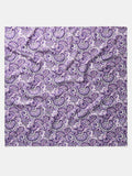 Purple paisley wild rag scarf with ornate swirl pattern, flat lay
