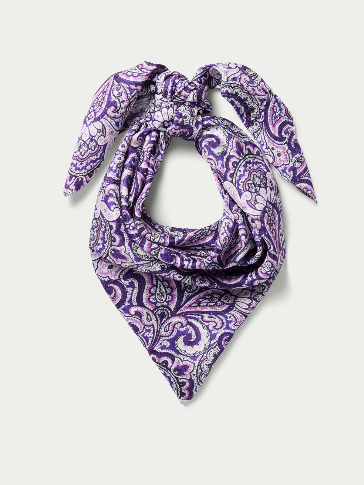 Purple paisley wild rag scarf draped and knotted into a triangle shape