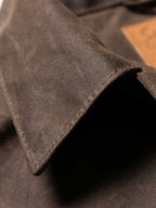 Mesquite brush jacket fabric and collar edge, dark brown woven texture