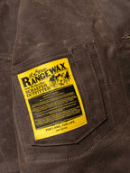 Mesquite brush jacket inner label patch, yellow RangeWax text on dark brown