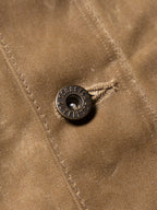 RangeWax® Mesquite brush jacket snap detail with brand button on sand fabric
