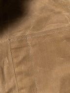 RangeWax® Mesquite brush jacket seam and stitching on sand canvas