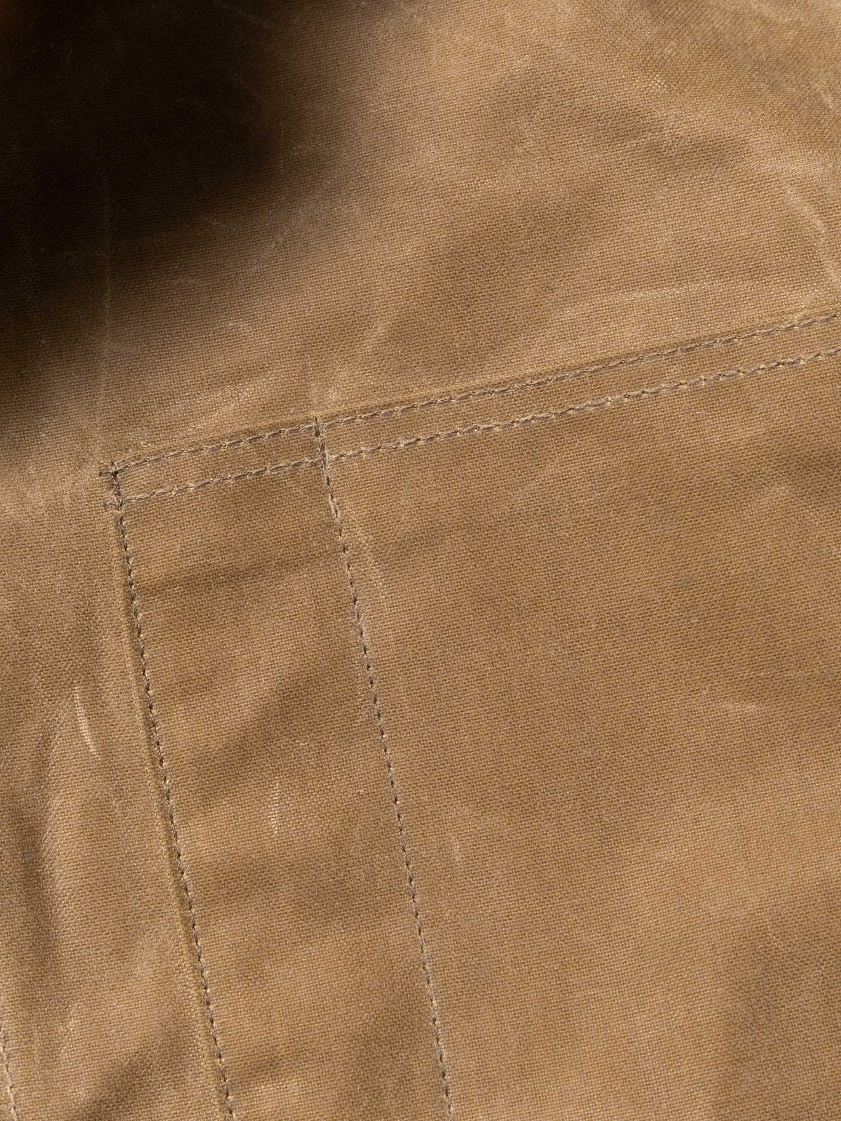RangeWax® Mesquite brush jacket seam and stitching on sand canvas