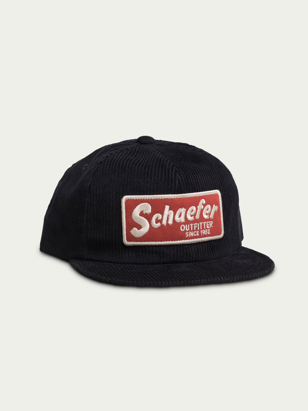 Navy corduroy trucker cap with front Schafer logo patch