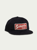 Navy corduroy trucker cap with front Schafer logo patch